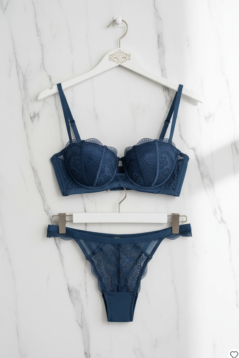 Navy blue lace lingerie set on hanger marble background